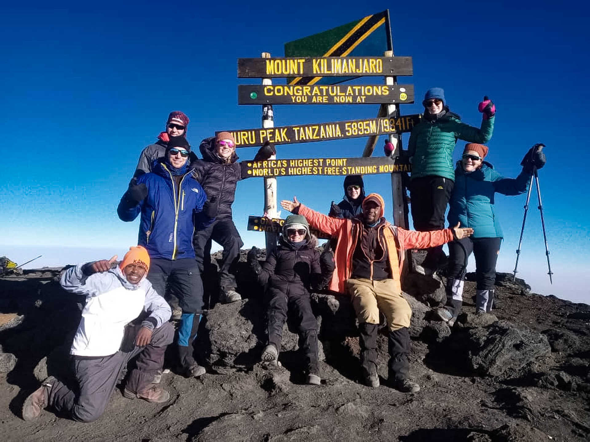 How do I celebrate reaching the summit of Kilimanjaro?