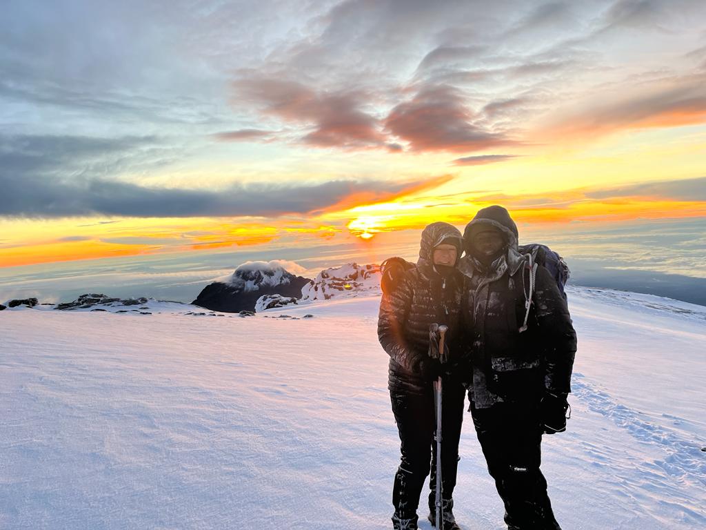 What should I do if I encounter a storm on Kilimanjaro?